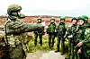 A Russian firearms instructor, left, gives instructions to North Korean soldiers who were involved in Russian military operations in the Kursk region in this undated footage shared by the Russian state media on April 28. [SCREEN CAPTURE]