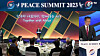 A man surnamed Yoon, a former director-general of the Unification Church, gives a speech while displaying a photo of former President Yoon Suk Yeol and first lady Kim Keon Hee seated at a dinner for African ambassadors in November 2022 during the opening ceremony of the Peace Summit 2023 held at Lotte Hotel World in Songpa District, southern Seoul, in 2023. [JOONGANG PHOTO]