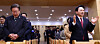 Democratic Party Chairman Lee Jae-myung, left, and former Land Minister Won Hee-ryong of the People Power Party, both running for Incheon’s Gyeyang-B District in the upcoming April 10 general election, attend an Easter service at a church in Gyeyang District, Incheon, Sunday morning. [JOINT PRESS CORPS]