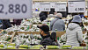 Shoppers purchase groceries at a supermarket in Seoul on Dec. 3. [YONHAP]