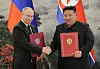 North Korean leader Kim Jong-un, right, shakes hands with Russian President Vladimir Putin in Pyongyang after signing a comprehensive strategic partnership treaty in June. [RODONG SINMUN]