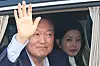 Former President Yoon Suk Yeol and his wife Kim Keon Hee greet supporters as they leave the presidential residence in Hannam-dong, Yongsan District, central Seoul, and head to their private home in Seocho-dong in southern Seoul on April 11. [JOINT PRESS CORPS]