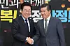 President Lee Jae-myung, left, shakes hands with American Chamber of Commerce in Korea Chairman and CEO James Kim in this undated photo. [AMCHAM]