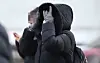 A pedestrian walks across the Gwanghwamun Square in central Seoul with a thick coat and gloves, on Jan. 5. [NEWS1]
