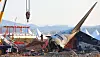 Fire authorities inspect a site where Jeju Air's Boeing 737-800 aircraft was collided with the concrete embankment six days ago at Muan International Airport in South Jeolla. [YONHAP]