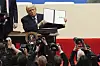 U.S. President Donald Trump holds up an executive order after signing it at an indoor Presidential Inauguration parade event in Washington on Jan. 20. [AP/YONHAP]