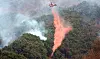 A helicopter disperses fire retardants on a mountain ridge in Sancheong County, South Gyeongsang, on March 25. Photo is unrelated to the article. [YONHAP]