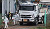 Quarantine workers move quickly through a pig farm in Dangjin, South Chungcheong on Nov. 25. [NEWS1]