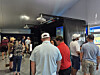 Spectators visiting the promotional booth at Oakmont Country Club in Pennsylvania, the venue of last year’s U.S. Open, try out the Golfzon simulator. [SUNG HO-JUN]