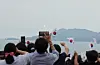 People watch from the Goheung Space Launch Observatory in Goheung, South Jeolla as Korea's homegrown space rocket Nuri has its third launch on May 25, 2023. [YONHAP]