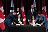 Foreign Affairs ministers Cho Hyun of Korea, seated left, and Anita Anand of Canada, seated right, participate in a signing with Defense Ministers Ahn Gyu-back of of Korea, standing left, and David McGuinty of Canada, standing right, for an agreement on Protection of Military and Defence Classified Information, in Ottawa, Ontario, on Feb. 25. [AP/YONHAP]