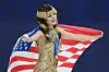Gold medalist Alysa Liu of the United States celebrates her medal after competing in the women's free skate program in figure skating at the 2026 Winter Olympics in Milan on Feb. 19. [AP/YONHAP]
