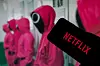 The Netflix logo is shown in front of the Pink Guards from ″Squid Game″ (2021-). [JOONGANG ILBO]
