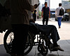 A patient sits in a wheelchair in front of a hospital in Seoul on Wednesday. [YONHAP]