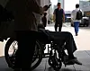 A patient sits in a wheelchair in front of a hospital in Seoul on Wednesday. [YONHAP]