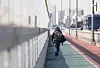 A high fence intended to stop suicides is seen installed on Mapo Bridge in Seoul on Feb. 27. [YONHAP]