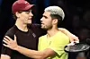 Italy's Jannik Sinner, left, is congratulated by Spain's Carlos Alcaraz at the end of their men's singles final match at the ATP Finals tennis tournament in Turin, on Nov. 16, 2025. [AFP/YONHAP]