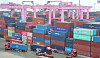 Workers load and unload containers at Incheon New Port in Incheon on May 16. [NEWS1]