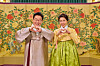 President Lee Jae Myung, left, and first lady Kim Hea Kyung pose for a photo after Lee delivers a Lunar New Year's message, in this photo provided by Cheong Wa Dae on Feb. 16. [YONHAP]