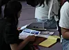 A job seeker looks through a list of hiring companies at the Job Fair for International Students hosted in Busan on Sept. 27, 2024. [SONG BONG-GEUN]