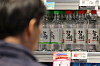 Bottles of soju are on display at a supermarket in Seoul. [YONHAP]