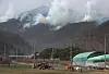Smoke is seen rising from mountains in Uiseong County, North Gyeongsang on Monday as wildfire continues to burn in the area. [NEWS1]