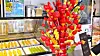 Tanghulu, a sweet created by skewering assorted fruits coated with a layer of sugary syrup, is on display at the store in Mapo District, western Seoul, on Oct. 10, 2023. [JOONGANG ILBO]