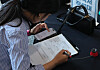 A job seeker fills out a resume form at the Busan International Student Job Fair on Sept. 27, 2024. [SONG BONG-GEUN]