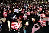 Protesters holding banners and light sticks call for President Yoon Suk Yeol's impeachment and arrest in front of the National Assembly in Seoul on Dec. 9, 2024. [YONHAP]