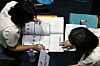 A parent receives college admissions advice from a counselor at an admissions fair at Seoul City Hall on Aug. 9. [NEWS1]