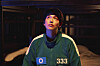 Still from the second season of ″Squid Game″ (2021-). Here shows actor Yim Si-wan, who plays a former crypto YouTuber who joins the titular game as a contestant. [NETFLIX]