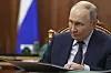 Russian President Vladimir Putin speaks with Alexander Avdeyev, the governor of Vladimir region, during their meeting at the Kremlin in Moscow, Russia, on July 18. [AP/YONHAP]