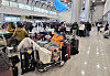 Passengers wait for the resumption of flights at Jeju International Airport on Feb. 8, 2026, as heavy snow grounded flights on Korea's southern island of Jeju. [YONHAP]