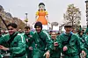 People play 'Red Light, Green Light' during an offline event ahead of the release of season two of Netflix's 'Squid Game' in Paris on Dec. 2. Here shows 456 randomly selected participants for the event running away from the giant robot doll Younghee. [NEWS1]