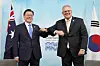 President Moon Jae-in, left, with Australia's Prime Minister Scott Morrison, meet on the sideline of the G7 summit in Cornwall, England, in June. [BLUE HOUSE]
