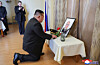North Korean leader Kim Jong-un offers flowers to the portrait of Russia's Ambassador Aleksandr Matsegora during his condolence visit to the Russian Embassy in Pyongyang on Dec. 10. [YONHAP]