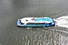A Hangang Bus operates near Yeongdong Bridge in Seoul on July 1, the first day of its trial service. [YONHAP]