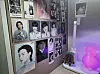 Photos of K-pop stars are displayed on the wall of Ines Bengochea's desk. [INES BENGOCHEA]