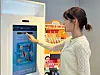 A customer uses GS25's beauty kiosk