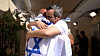 Released Israeli hostage, Omri Miran, held in Gaza since the deadly Oct. 7, 2023 attack by Hamas, embraces his father, Dani Miran, after his release as part of a prisoner-hostage swap and a ceasefire deal between Israel and Hamas, in Reim, Israel Oct. 13. [REUTERS/YONHAP]