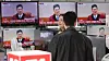 People watch the Constituitional Court reading its verdict on President Yoon Suk Yeol's impeachment in Yongsan District, central Seoul, on April 4. [NEWS1]