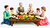 An image showing families dressed in hanbok (traditional Korean attire) having a holiday meal together [GETTY IMAGES BANK]