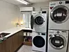 Laundry machines and dryers are at the shared laundry zone in the gosiwon (small, affordable single-room housing) building where Lydia Rouka lives. [LYDIA ROUKA]
