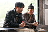 Behind-the-scene still from film ″The King's Warden,″ featuring director Chang Hang-jun, left, and actor Yoo Hai-jin [SHOWBOX]