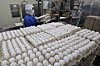 Employees sort, wash and package fresh eggs imported from the United States at an import company in Cheonan, South Chungcheong, on Jan. 26. [YONHAP]