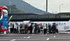 A group of tourists holds a drinking party in the parking area for large buses at Jinyeong Rest Area. [SCREEN CAPTURE}