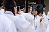 A student takes a photo while wearing the traditional attire of a Confucian scholar from the Joseon Dynasty (1392-1910) during a freshman orientation ceremony on March 16, 2025. [NEWS1]