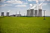 Pylons carry high voltage electricity cables across a field past cooling towers operating at the Dukovany nuclear power plant operated by CEZ AS, near the village of Dukovany, Czech Republic, on May 12. [EPA/YONHAP]