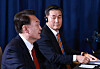 National Security Adviser Shin Won-sik, right watches Korean President Yoon Suk Yeol speak at a trilateral summit with the leaders of the United States and Japan on the margins of the APEC summit in Peru on Nov. 15. [JOINT PRESS CORPS]
