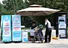 A Nowon district official hands out a free bottle of water to a passerby on a street in Nowon District, northern Seoul, last summer. [NOWON DISTRICT OFFICE]